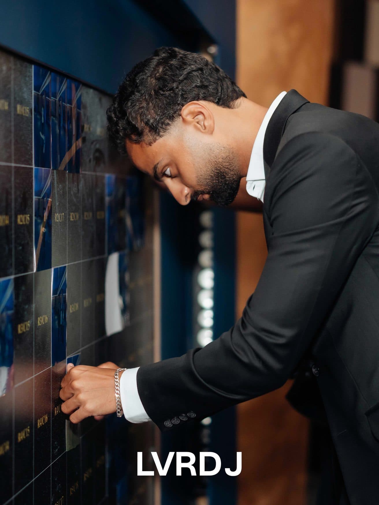 Guest finding his name on the illuminated name wall