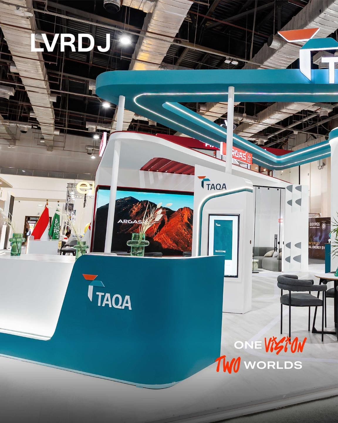 Curved teal-and-white TAQA exhibition stand