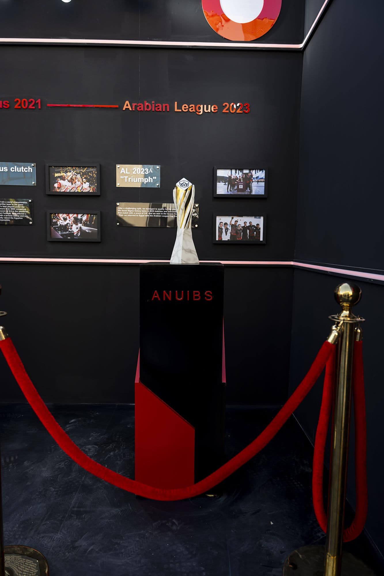 League trophy behind red velvet rope